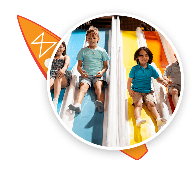 Kids playing on indoor Bounce Beach features at Malibu Jack's.