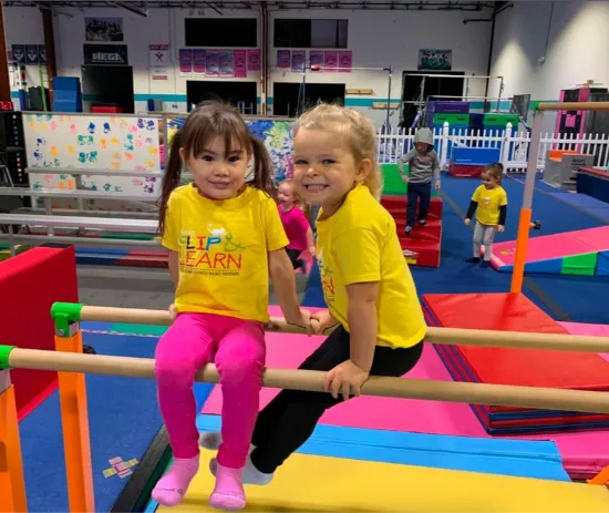 Children using the gymnastics-floor play space during a MEGA session.