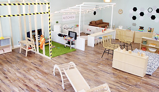Imaginative play space with open floor layout at Mezanmi Play Cafe