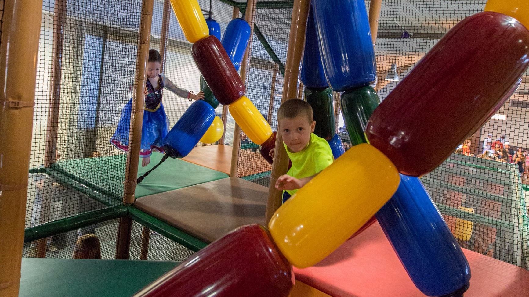 Children inside the elevated indoor play structure at Miller Activity Complex.