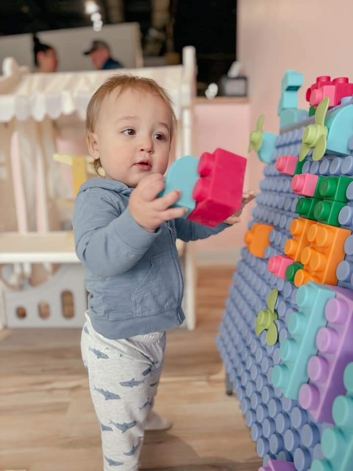 Toddler-sized play area with oversized building blocks.