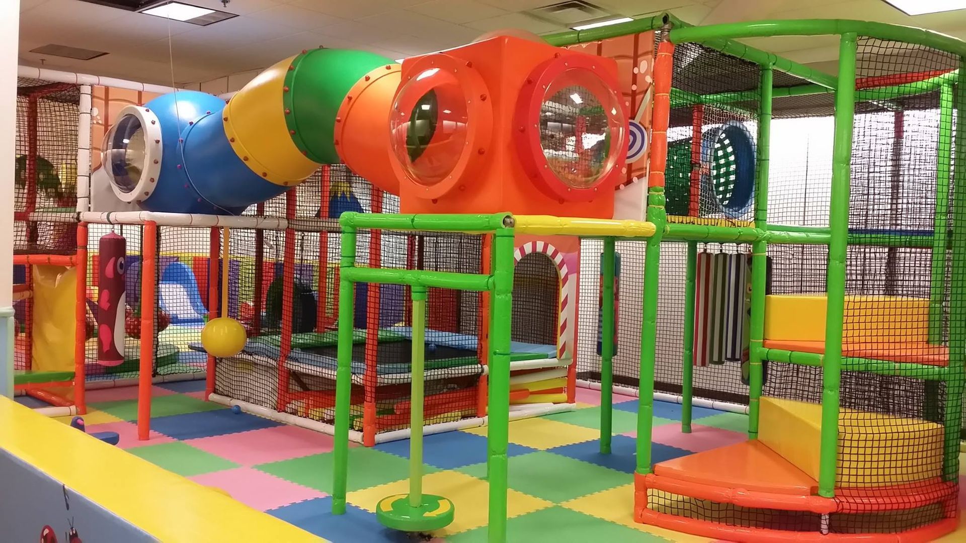 MonkeyCOS Playground indoor play structure and seating area