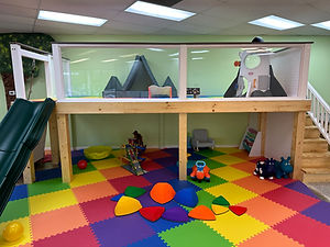 Indoor play loft and activity area at Munchkin Town