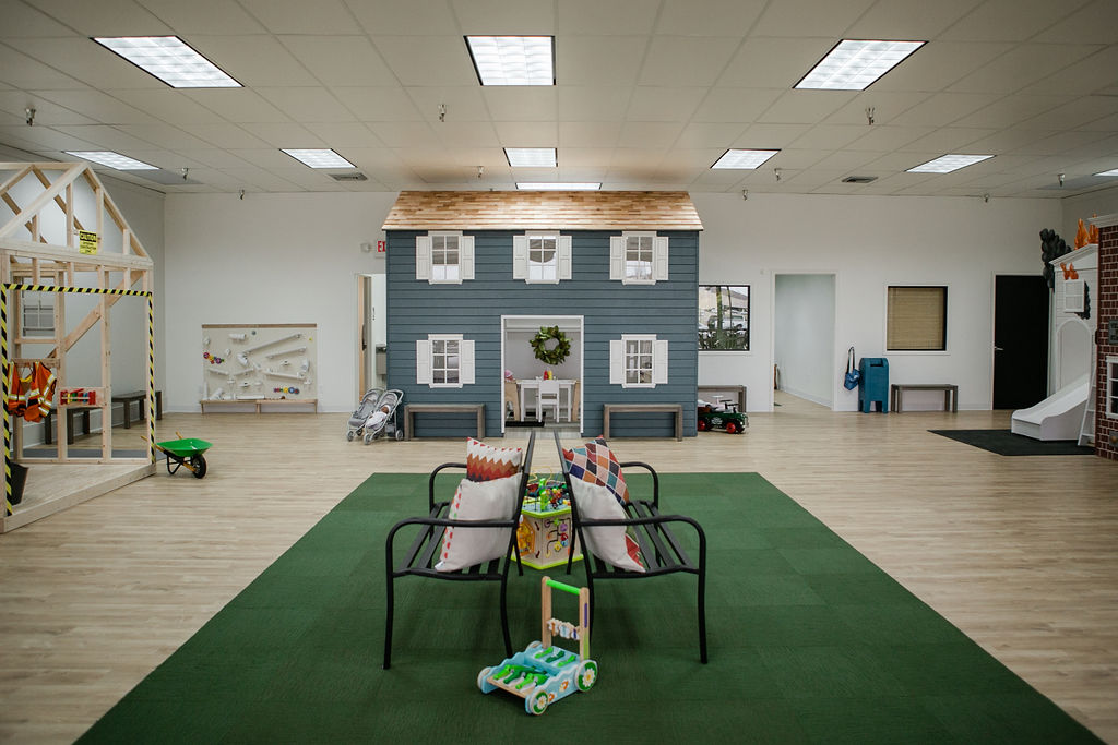 Pretend-play storefront setup inside My Play Village.
