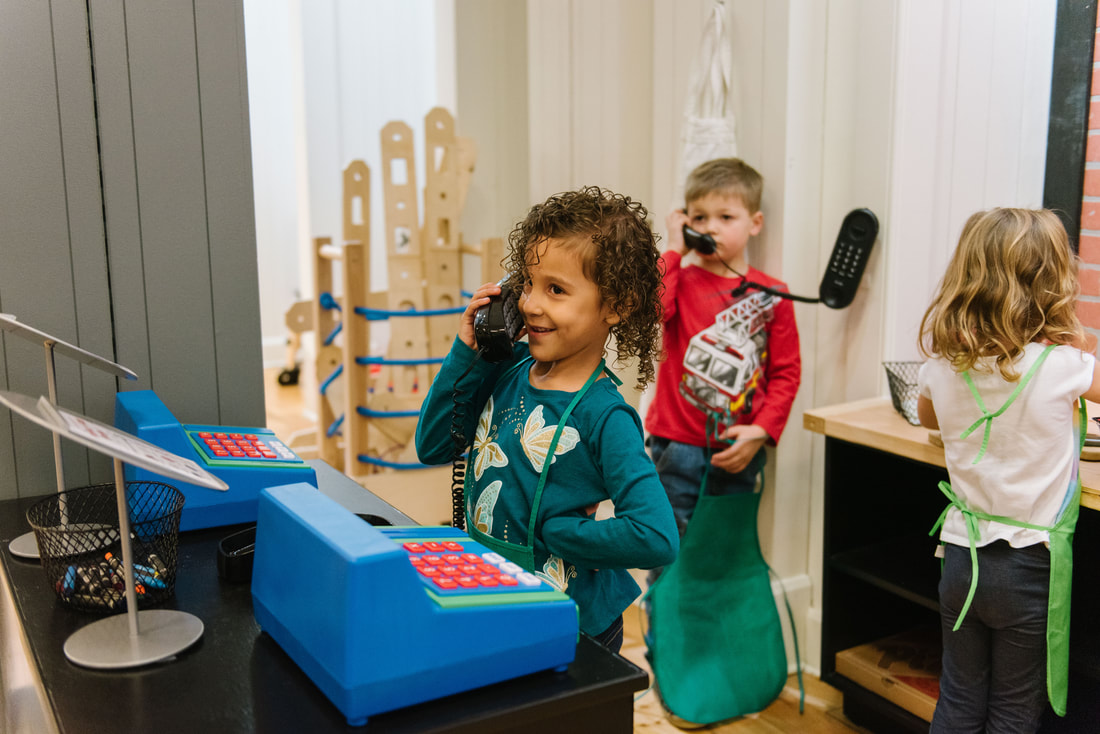 Pretend market and checkout play area at My World Discovery Museum