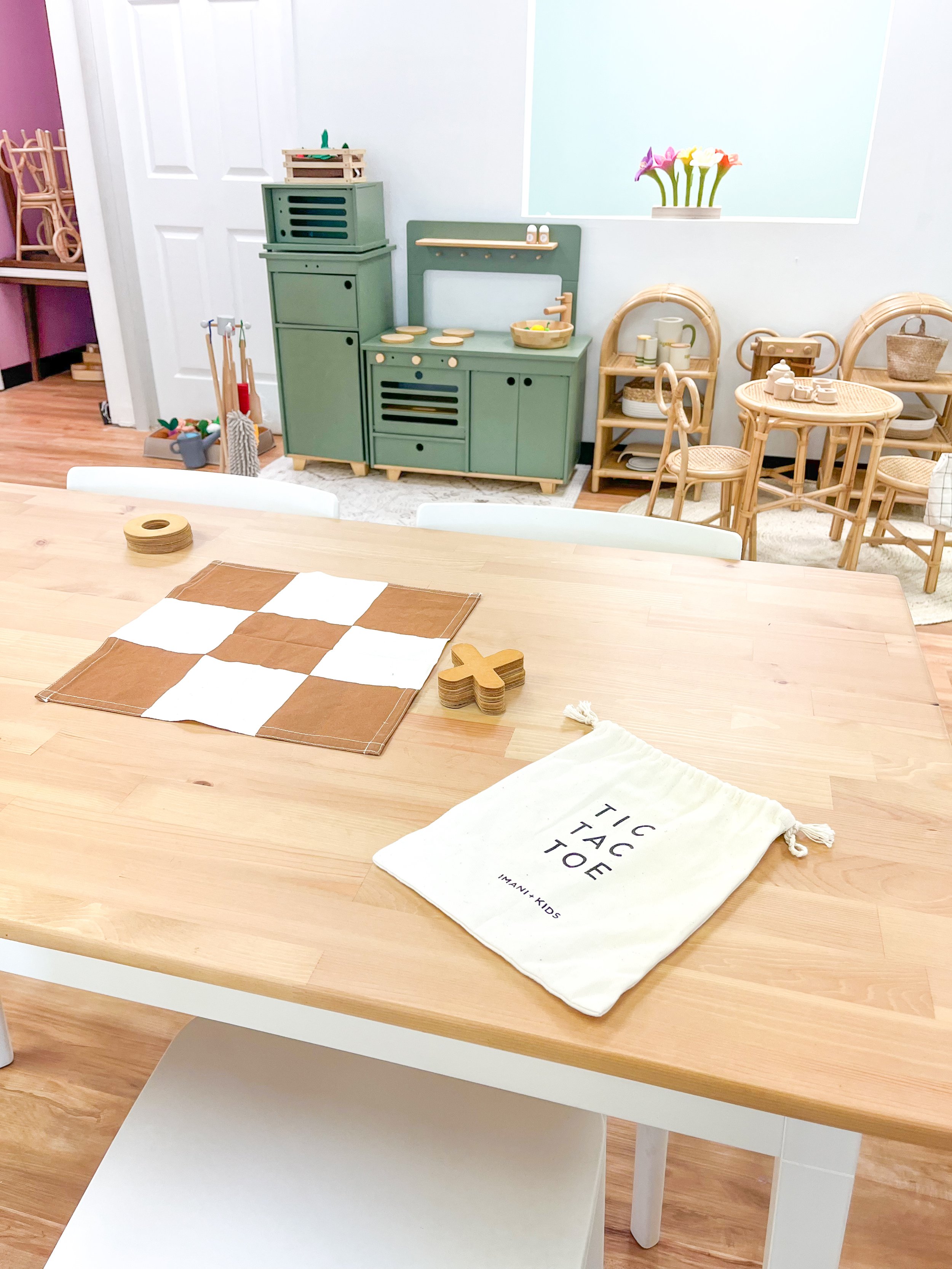 Pretend kitchen and child-sized seating at Natural Nest Play Cafe Newark.