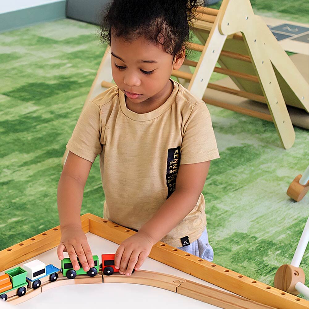Child-focused train play setup at New Day Play Cafe.