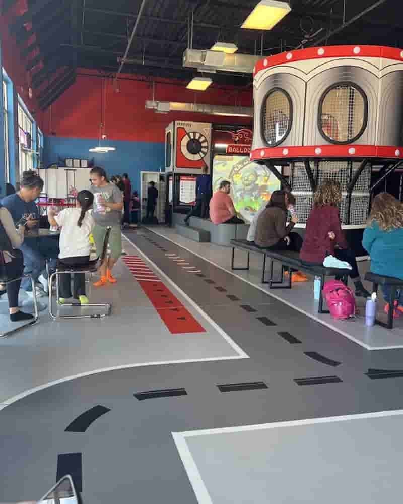 Seating area beside the play structure at Ninja Kingdom Adventure Park.