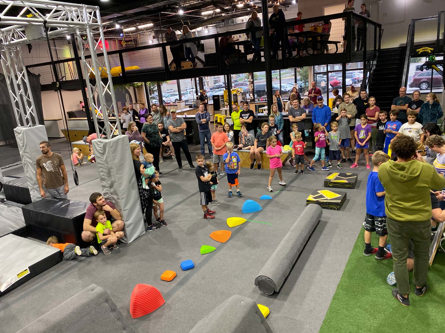 Obstacle floor and mezzanine party area at Ninja U Cedar Falls.