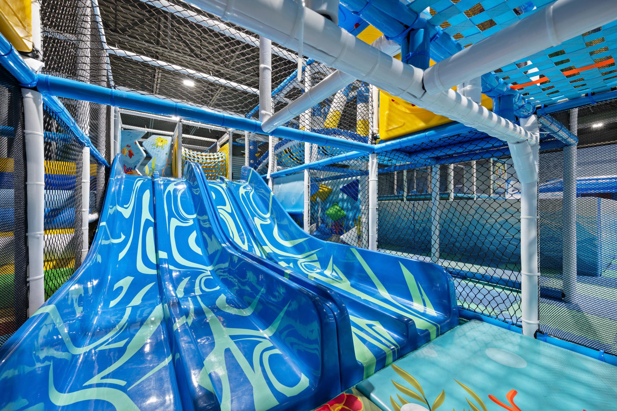 Children's play space with soft flooring and ocean-themed details