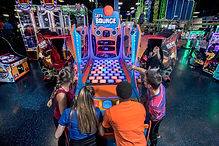 Indoor attraction space at Off The Wall with active play features.