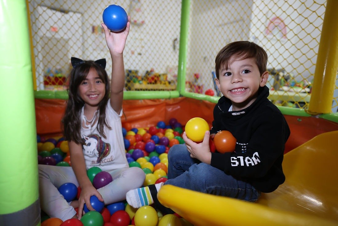 Children playing in the ball pit at Planet Kids Playground & Cafe.