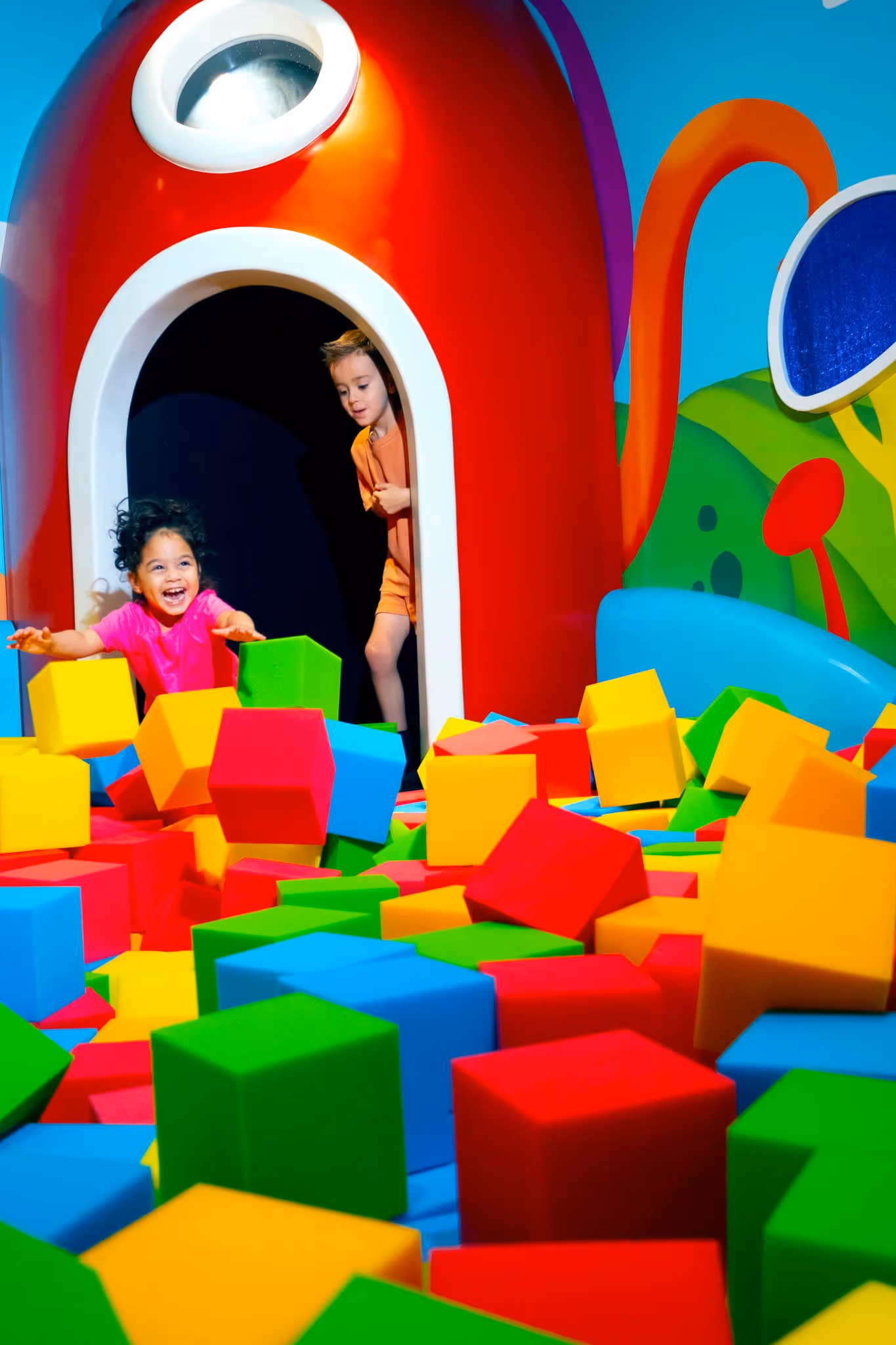 Kids playing in the foam cube pit at Play-Doh’s Imagination Station inside Planet Playskool.