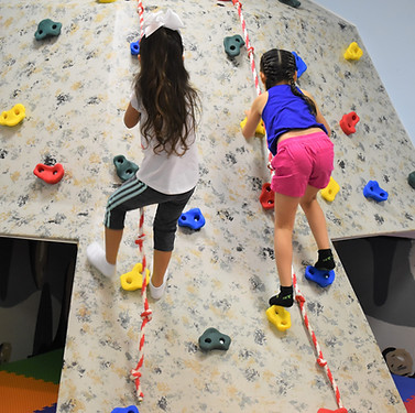 Children climbing and playing at Planet Sensory