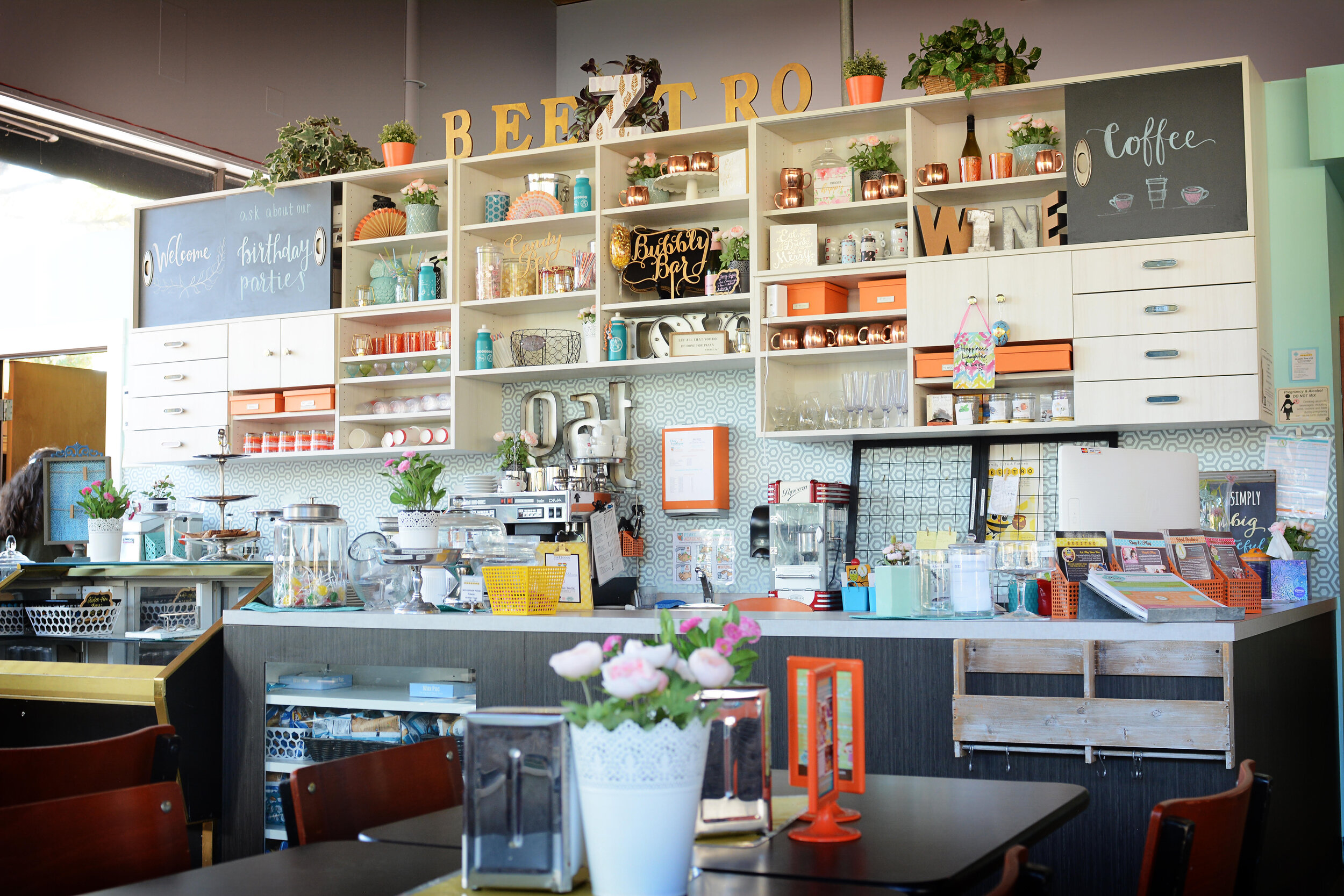 Cafe seating and food counter area at Play Boutique
