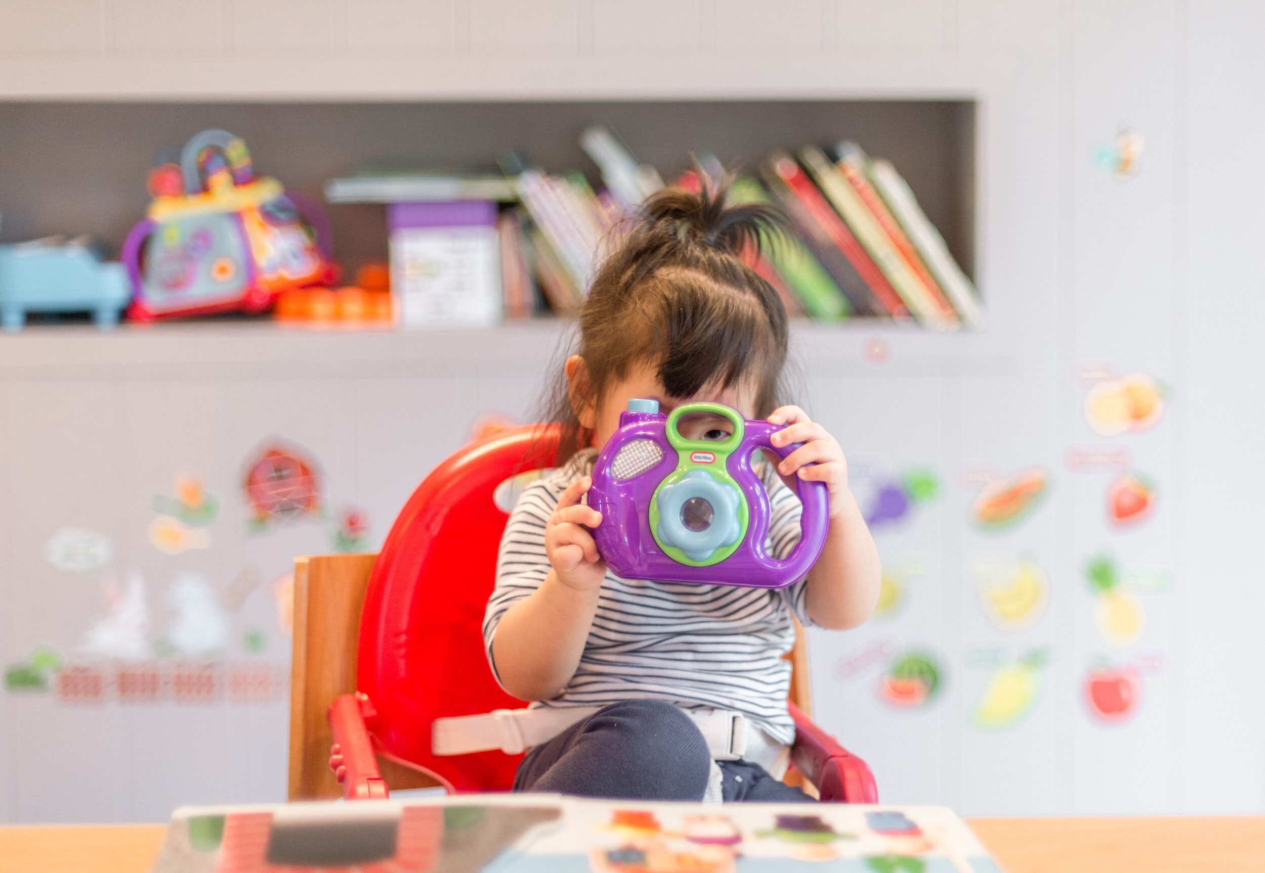 Young child exploring a discovery-play setup at Play Boutique
