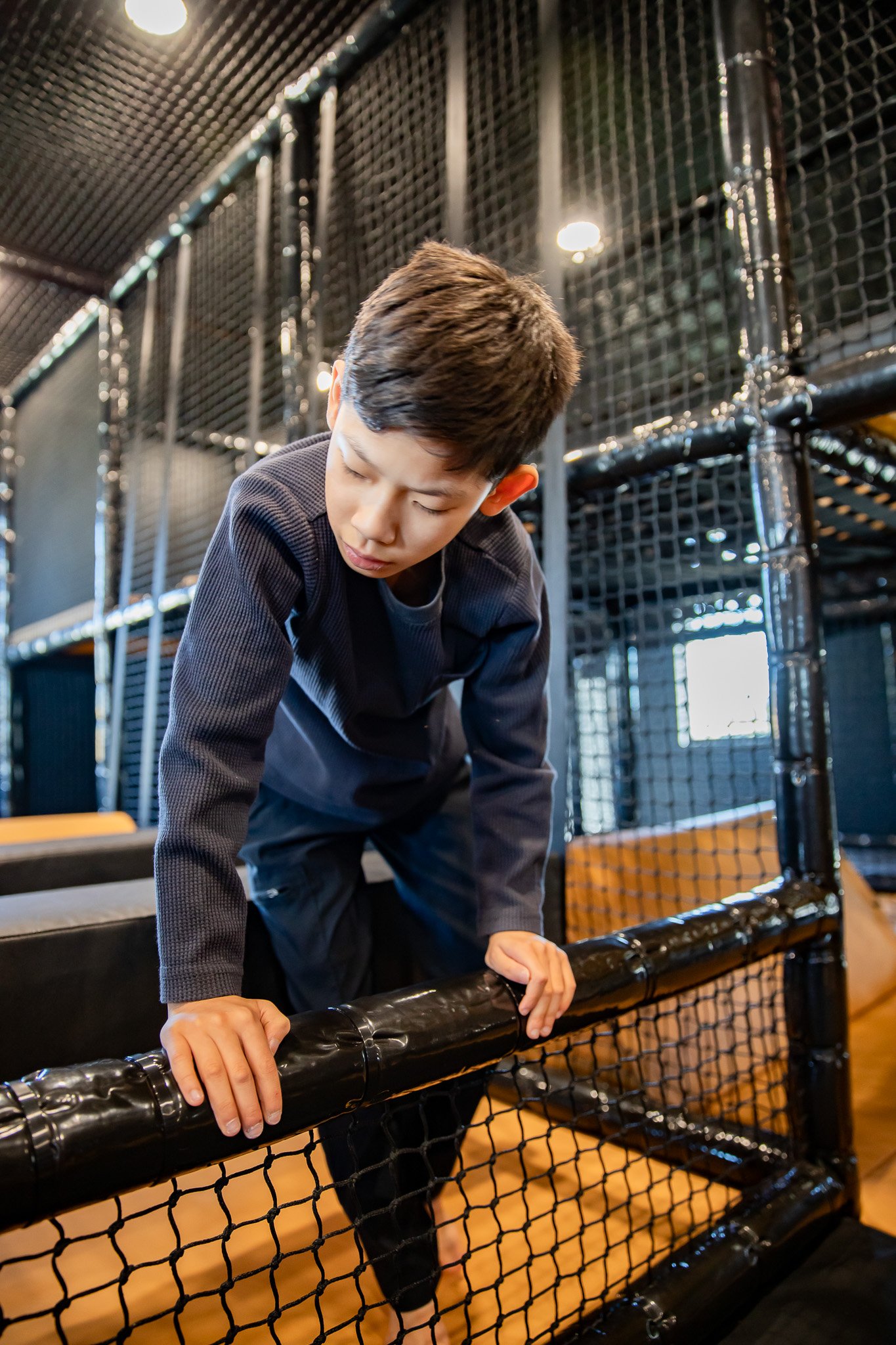 Child climbing inside Play Gallatin