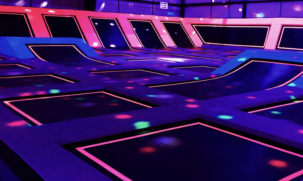 Neon trampoline court at Play Lab Action Park