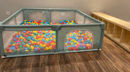 Indoor play setup at The Play + Learn at Little Milestones in Falmouth