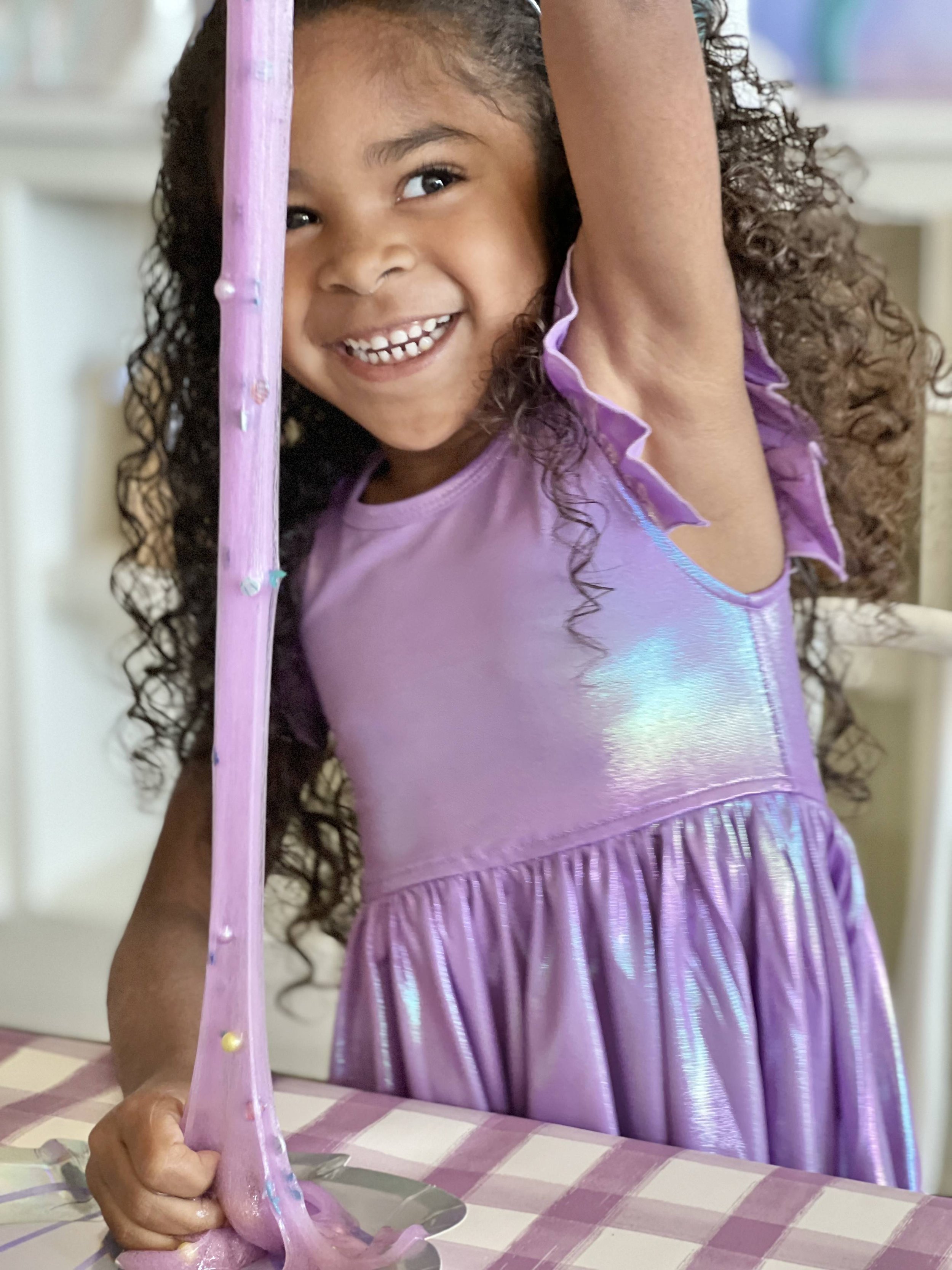Child enjoying slime activity at Play Street Museum Fayetteville