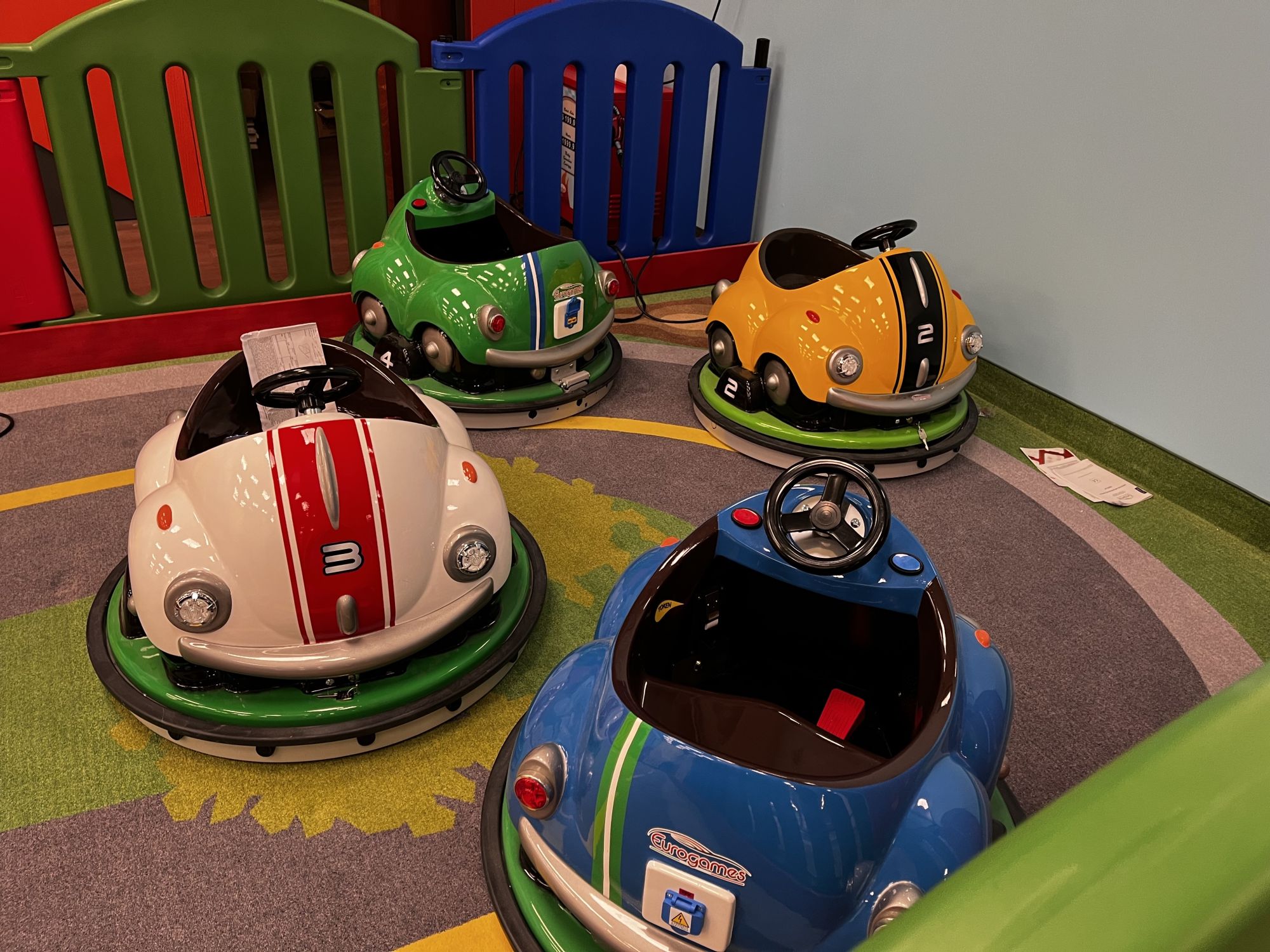 Indoor play structures and activity zones at Play Town & Café.