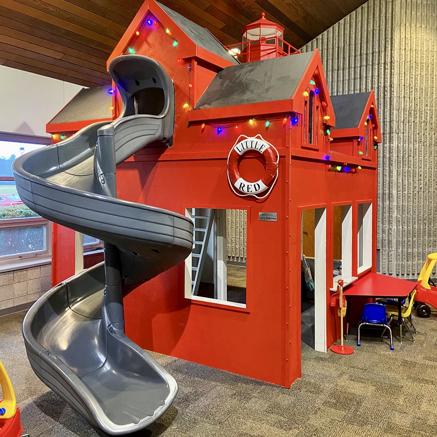 Lighthouse play structure with slide at PlayZone.