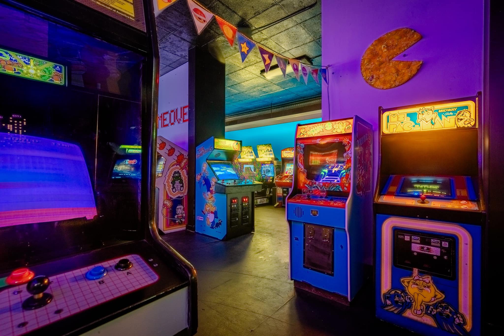 Arcade floor with game machines at Point Break Arcade.