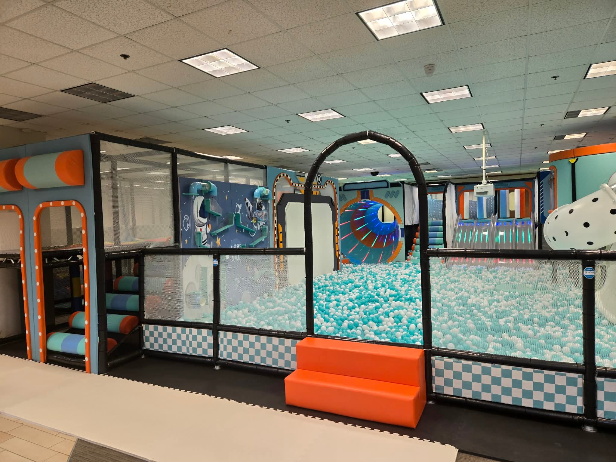 Indoor obstacle and play features inside ProKids Place.