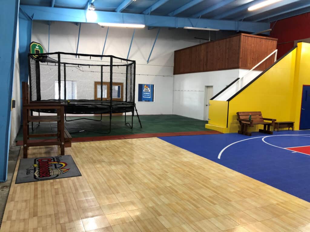 Trampoline and sport-court area inside Rainbow of the Heartland's Olathe showroom.