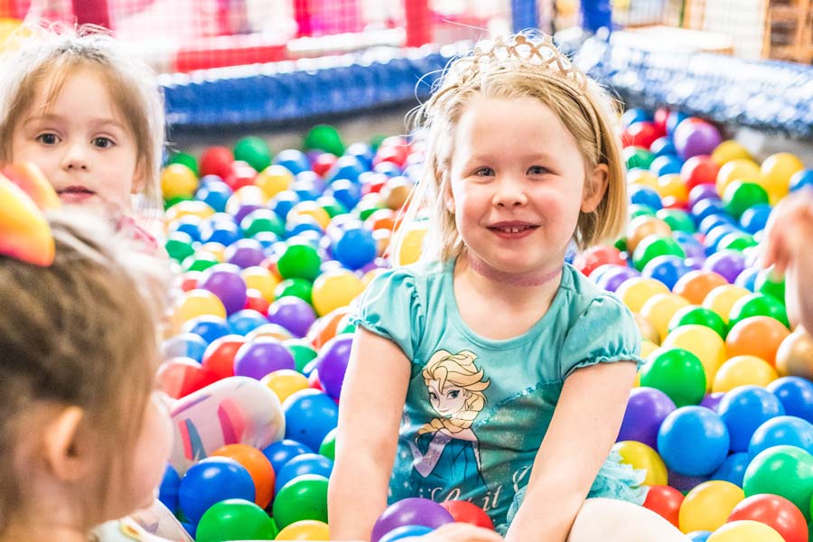 Children playing in the ball pit during a Ridge Kids Playzone birthday party