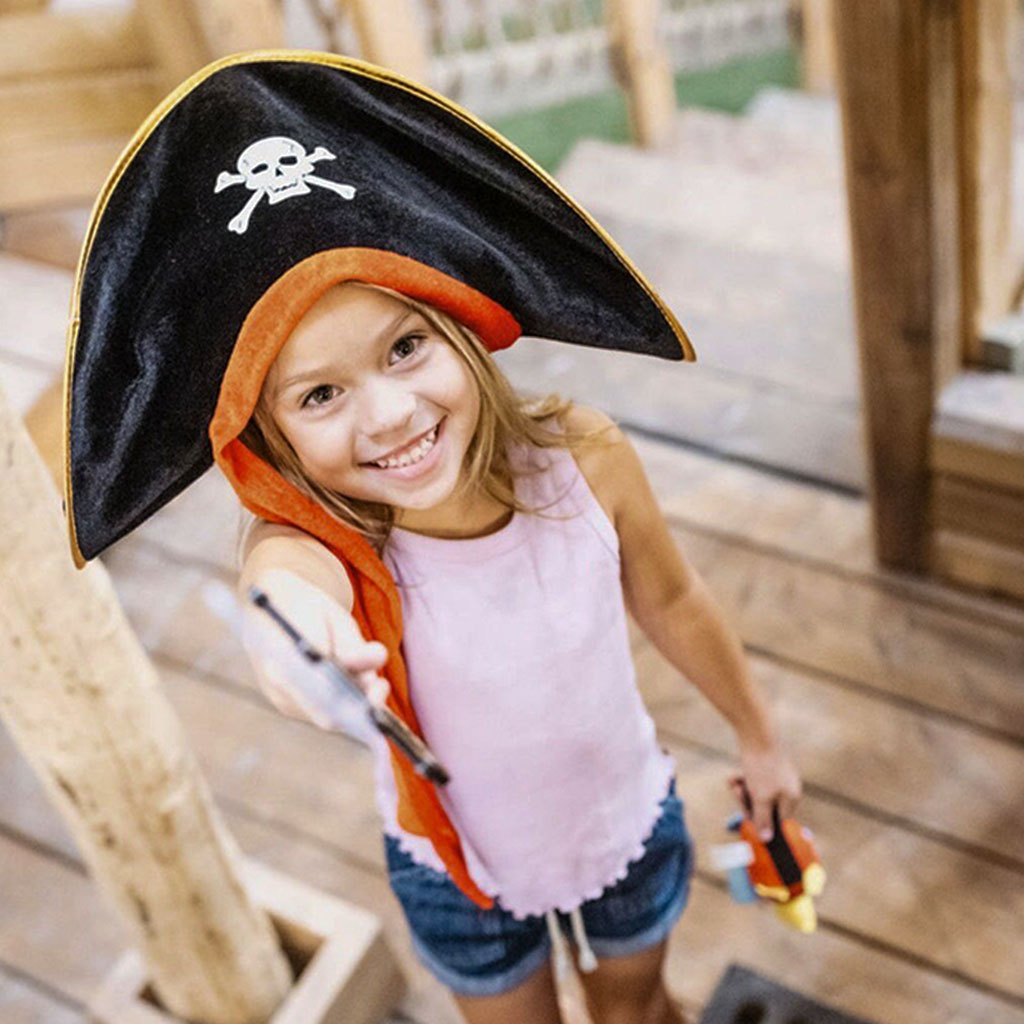 Child wearing pirate gear in a themed play scene at Rise Play Park.