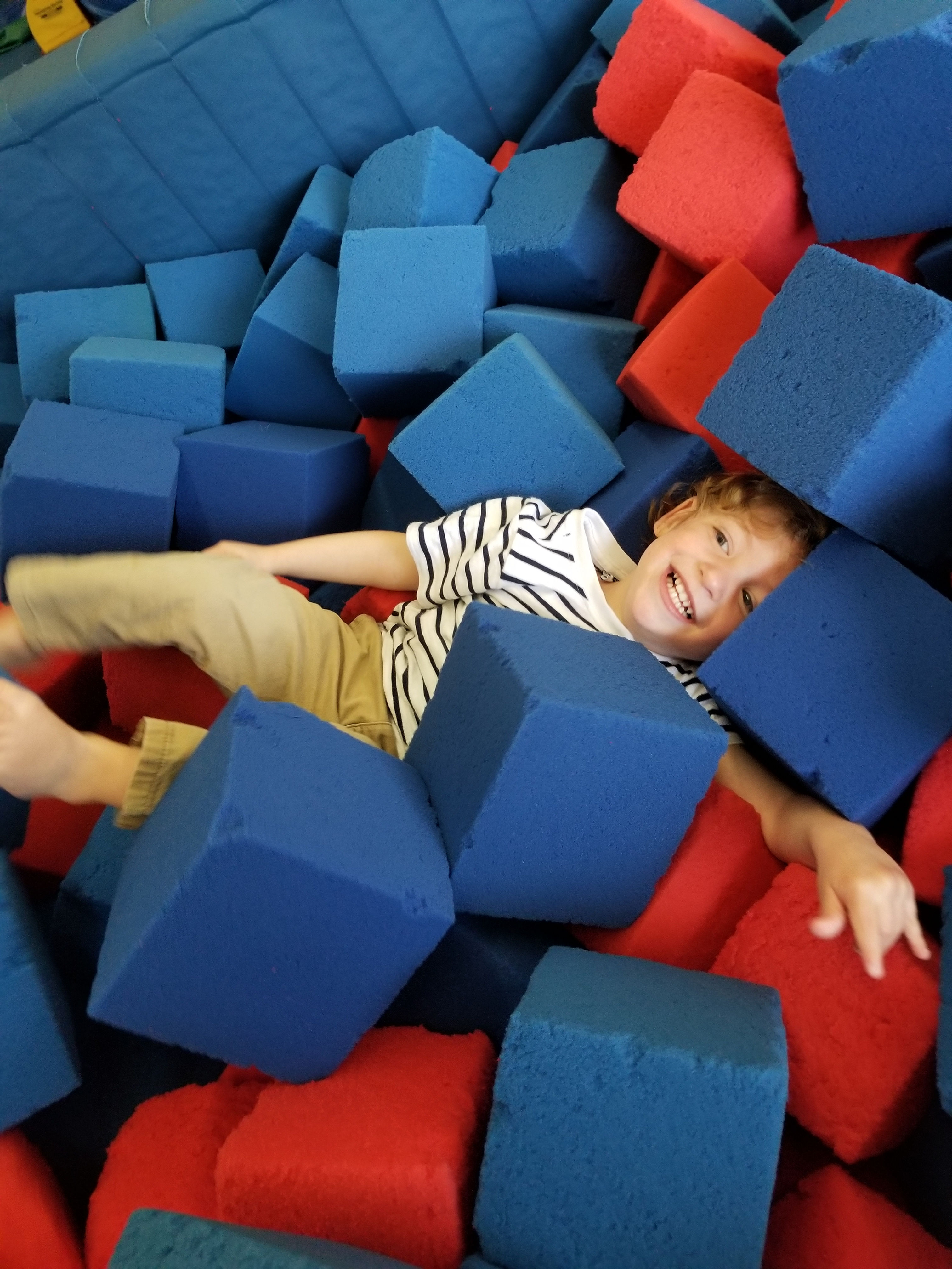 Foam pit play at Rolly Pollies
