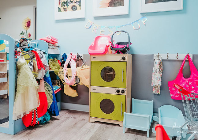 Dress-up and pretend-play corner at Room to Bloom.