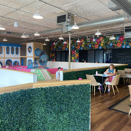 Cafe seating overlooking the play area at run+play kids cafe.
