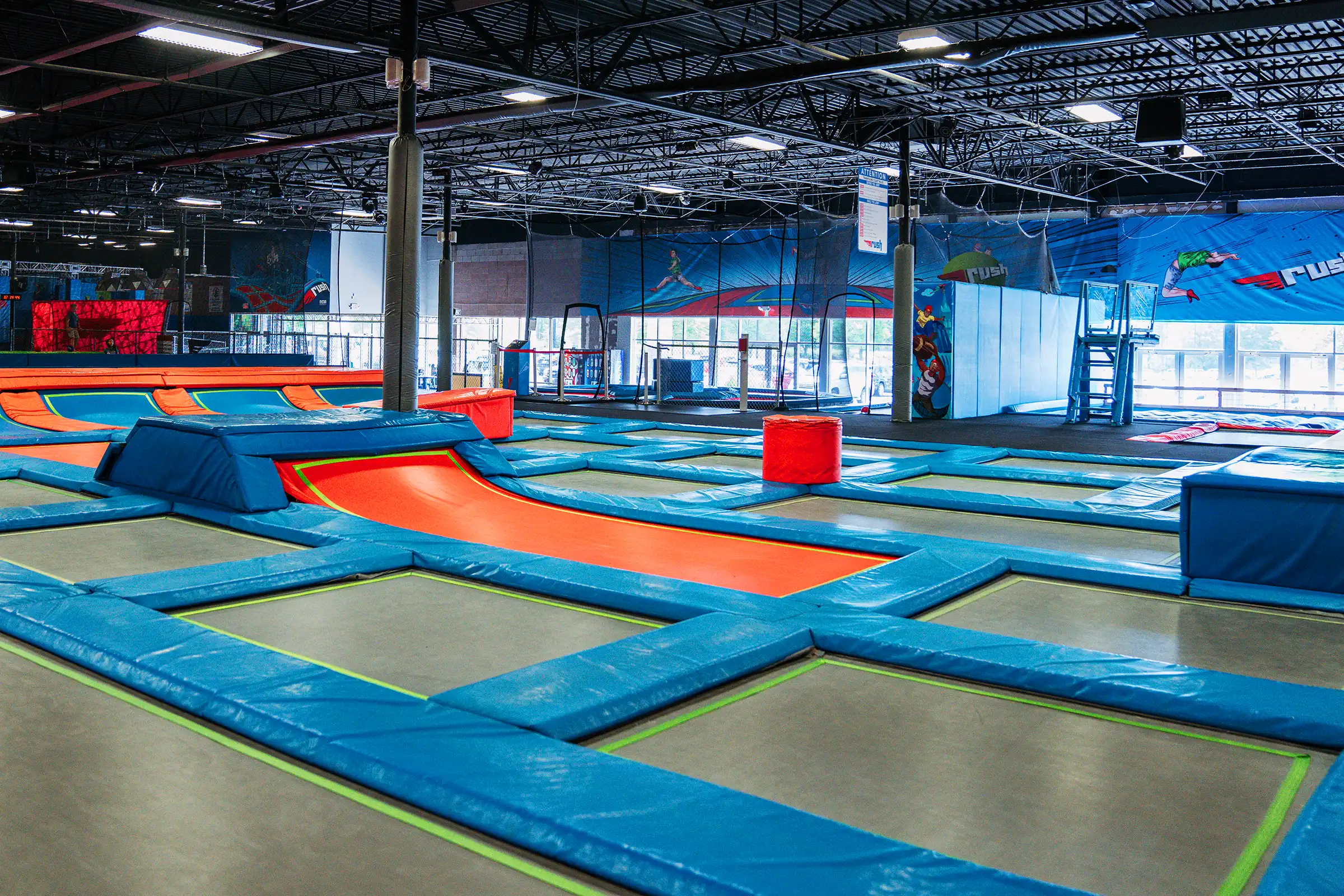Wide view of trampoline courts inside Rush Athens.