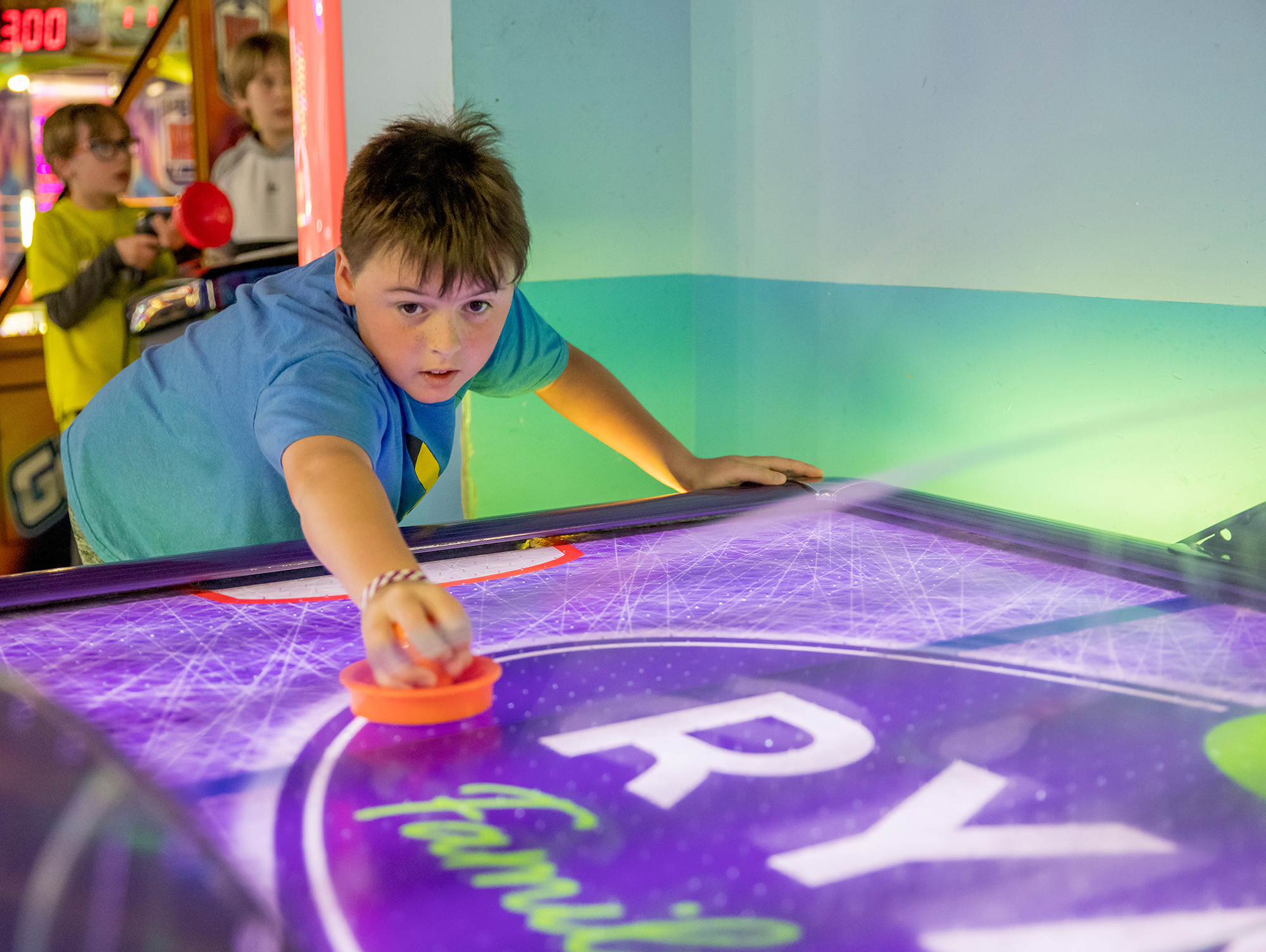Children playing air hockey at Ryan Family Amusements Newport
