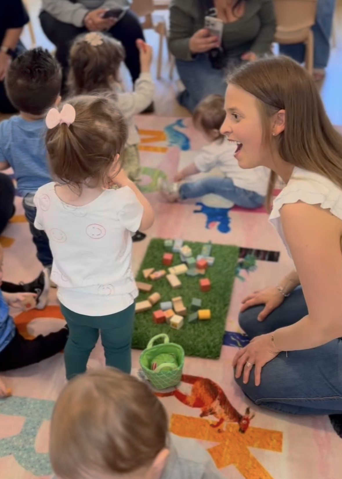 Caregivers and young children participating in a Schoolhouse Play & Cafe session.