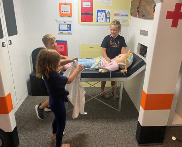 Kids playing in the Medical Arena pretend-play exhibit at the Science & Discovery Center of Northwest Florida.