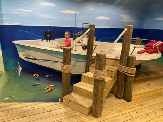 Boat Room exhibit with fishing-themed pretend play inside the Science & Discovery Center of Northwest Florida.