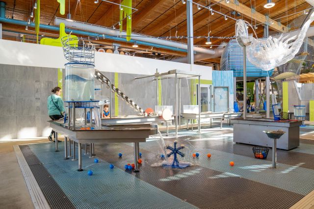 Children playing in the Amazeum's water exhibit area