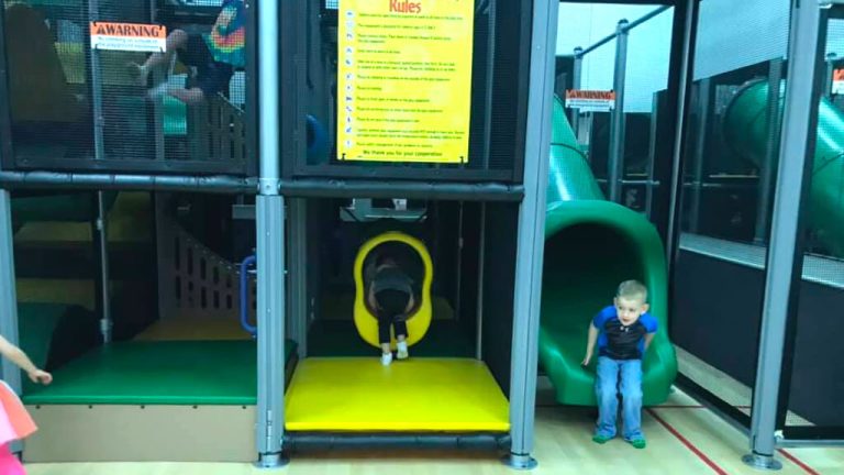 Green tube slide and yellow crawl opening inside the Hangtime Jr structure