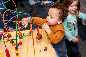 Children using tabletop sensory play equipment at Sensory Fun and Playroom.