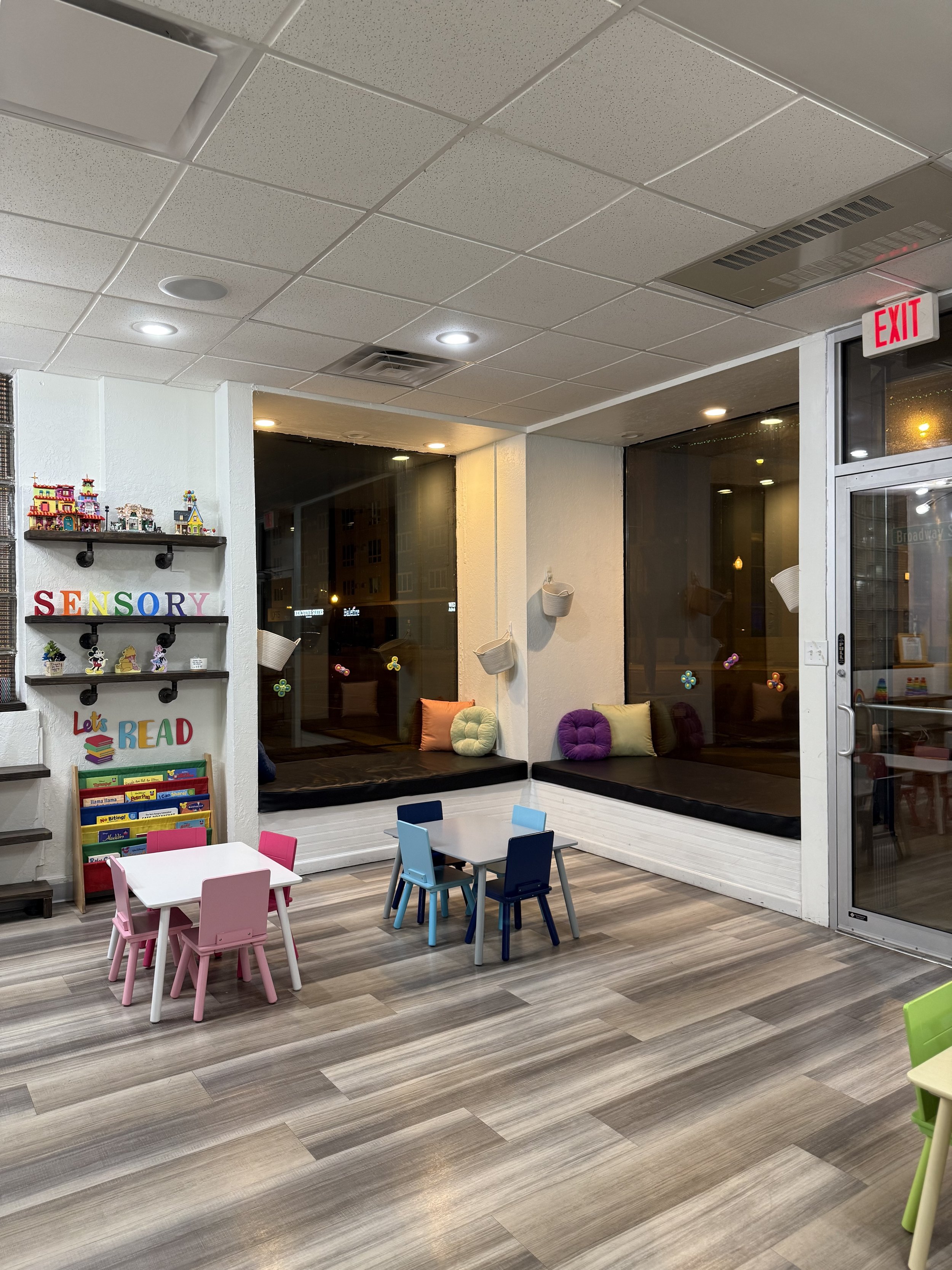 Reading nook and child-sized seating area at Sensory Open Play Group.