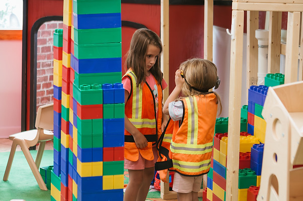 Children building and playing with oversized foam blocks at Sensory Seekers.