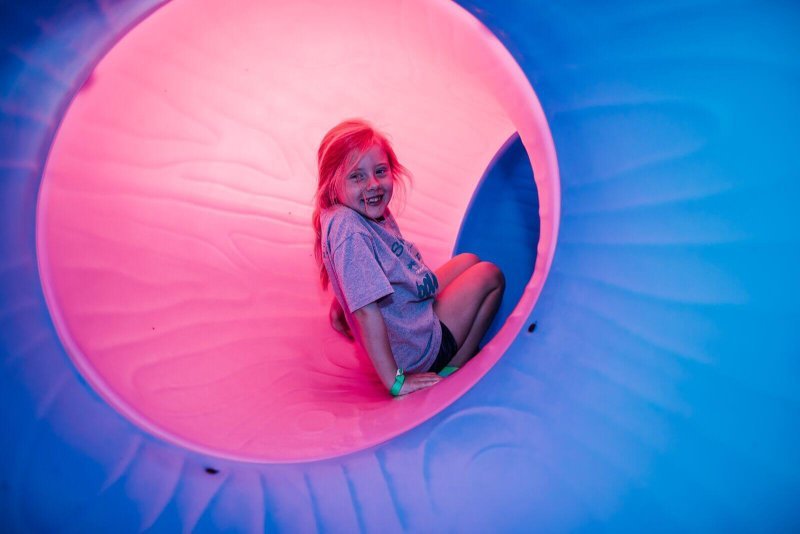 Child inside a tube slide at Shell We Bounce