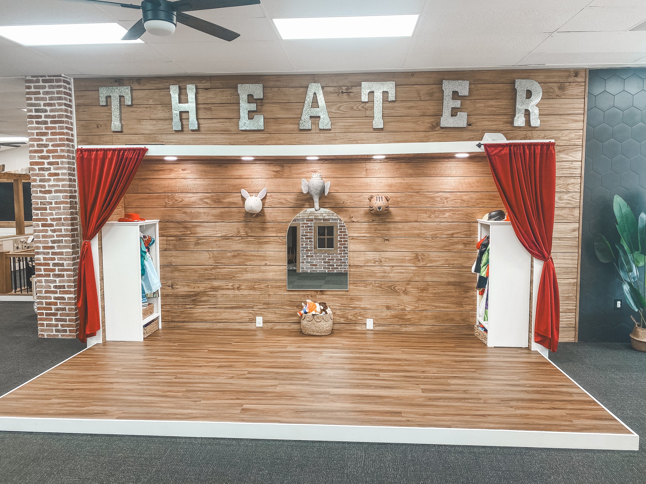 Pretend-play stage area at Simply Play Vero Beach
