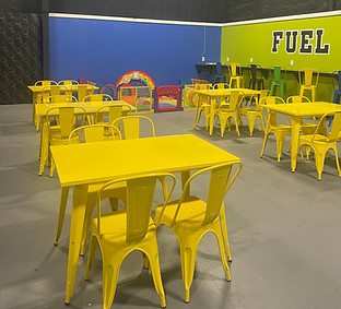 Tables and seating near the concession area at Sky High Fun Zone.