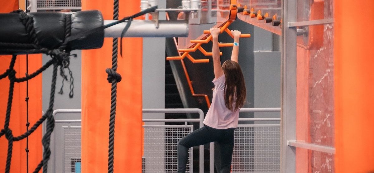 Child on the Ninja Warrior Course at Sky Zone.