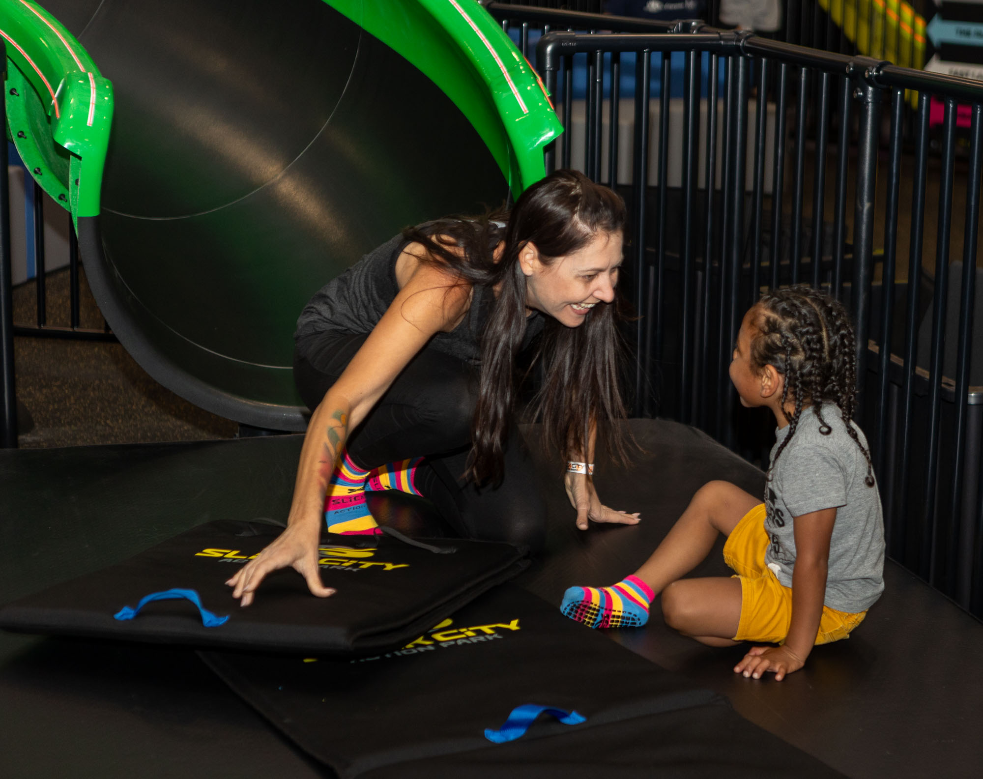 Children playing during a lower-stimulation sensory session at Slick City.