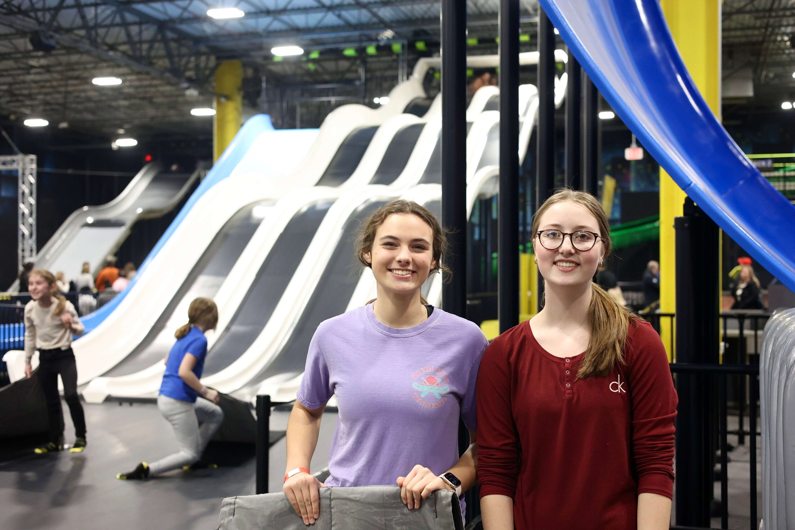 Wide view of slide lanes and play space at Slick City Tulsa.